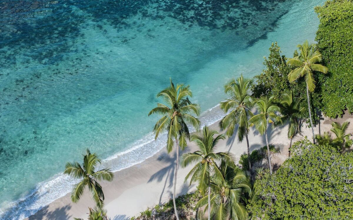 The diaphanous waters lap the shores by the hotel