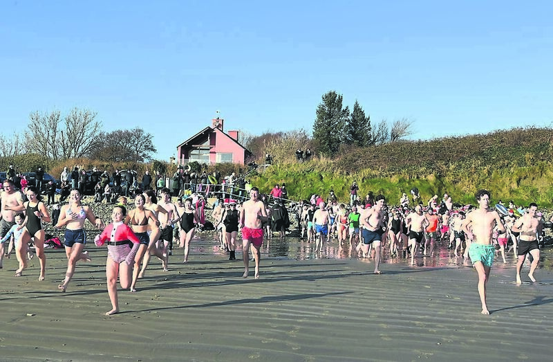 Dozens of hardy souls racing to the water for the Golden Jubilee Christmas Day Swim at Broadstrand, Courtmacsherry, West Cork. They were raising funds for the Paediatric Cystic Fibrosis Unit at Cork University Hospital and Horizons Cork (Cope Foundation) which support adults and children with intellectual disabilities. 	Picture: Martin Walsh
                    