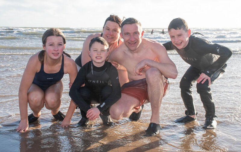 Paddy, Yvonne, Isla, Daithí, and Oisín Ryan from Conna taking part in the annual Christmas Day Swim in Youghal, Co Cork. Picture: Howard Crowdy