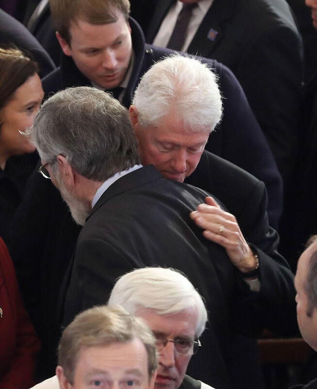 Former US president Bill Clinton hugs former Sinn Féin president Gerry Adams after the funeral of Northern Ireland's former deputy first minister and ex-IRA commander Martin McGuinness at St Columba's Church Long Tower, in Derry. Picture: Niall Carson/PA Wire/Rollingnews.ie