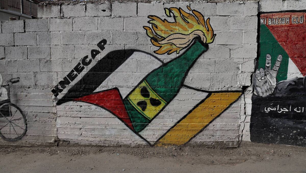 Around the corner from the Aclaí Gym is a fresh mural dedicated to Kneecap — of which Ó Cairealláin’s brother Naoise is a member.