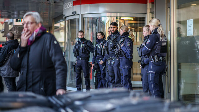A fire alarm summoned police officers and firefighters to the bank branch in Gelsenkirchen shortly before 4am on Monday (Christoph Reichwein/dpa via AP)