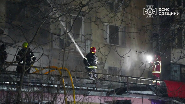 Emergency services personnel work to extinguish a fire following a Russian attack on Odesa, Ukraine (Ukrainian Emergency Service via AP)
