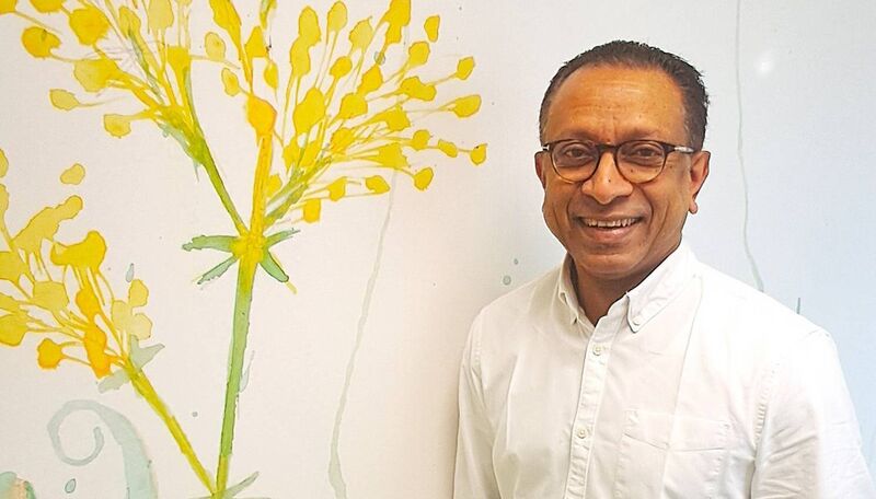 Roy Philip, adjunct professor of neonatology and consultant neonatologist and paediatrician at University of Limerick Hospitals and University of Limerick School of Medicine standing next to artwork of herbs traditionally used in healing painted on the walls of the new neonatal unit. Picture: HSE Midwest