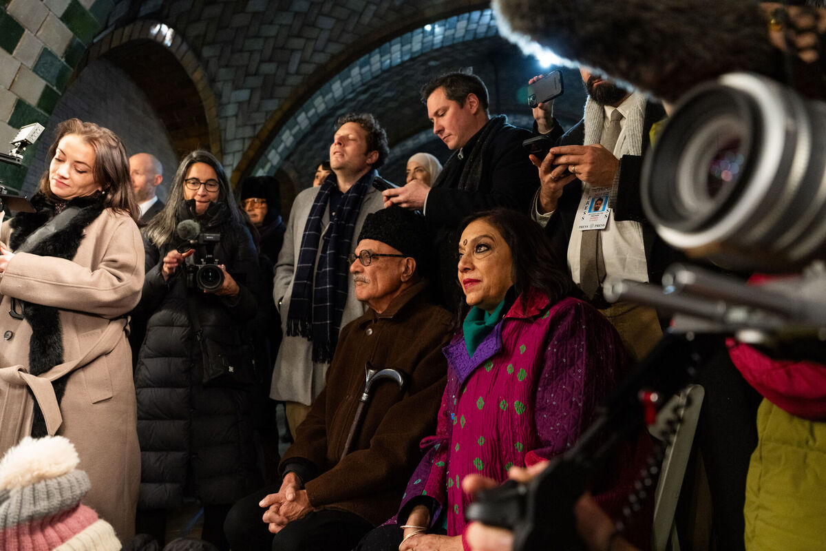 Mayor-elect Zohran Mamadni's mother, Mira Nair, right, and father, Mahmood Mamdani, center, watch as Zohran Mamdani takes the oath of office during a swearing-in ceremony in the Old City Hall subway station, Thursday, Jan. 1, 2026, in New York. (Amir Hamja/The New York Times via AP, Pool)