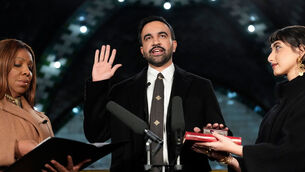 <p>New York Attorney General Letitia James, left, administers the oath of office to mayor-elect Zohran Mamdani, center, as his wife Rama Duwaji holds two Qurans, Thursday, Jan. 1, 2026, in New York. (AP Photo/Yuki Iwamura)</p>
