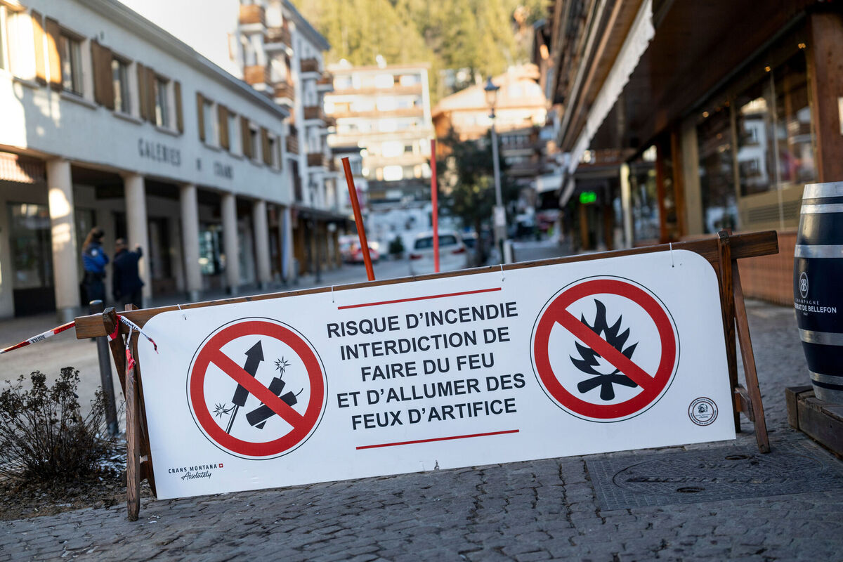A banner stating that fireworks are prohibited due to the risk of fire is pictured near the area where a fire broke out at the Le Constellation bar and lounge leaving people dead and injured, during New Year’s celebration, in Crans-Montana, Swiss Alps, Switzerland, Thursday, Jan. 1, 2026. (Alessandro della Valle/Keystone via AP)