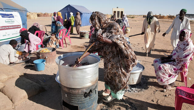 <p>Sudanese women displaced from El-Fasher cook meals at a community kitchen inside the newly established El-Afadh camp in Al Dabbah, in Sudan's Northern State. Picture: AP Photo/Marwan Ali</p>
