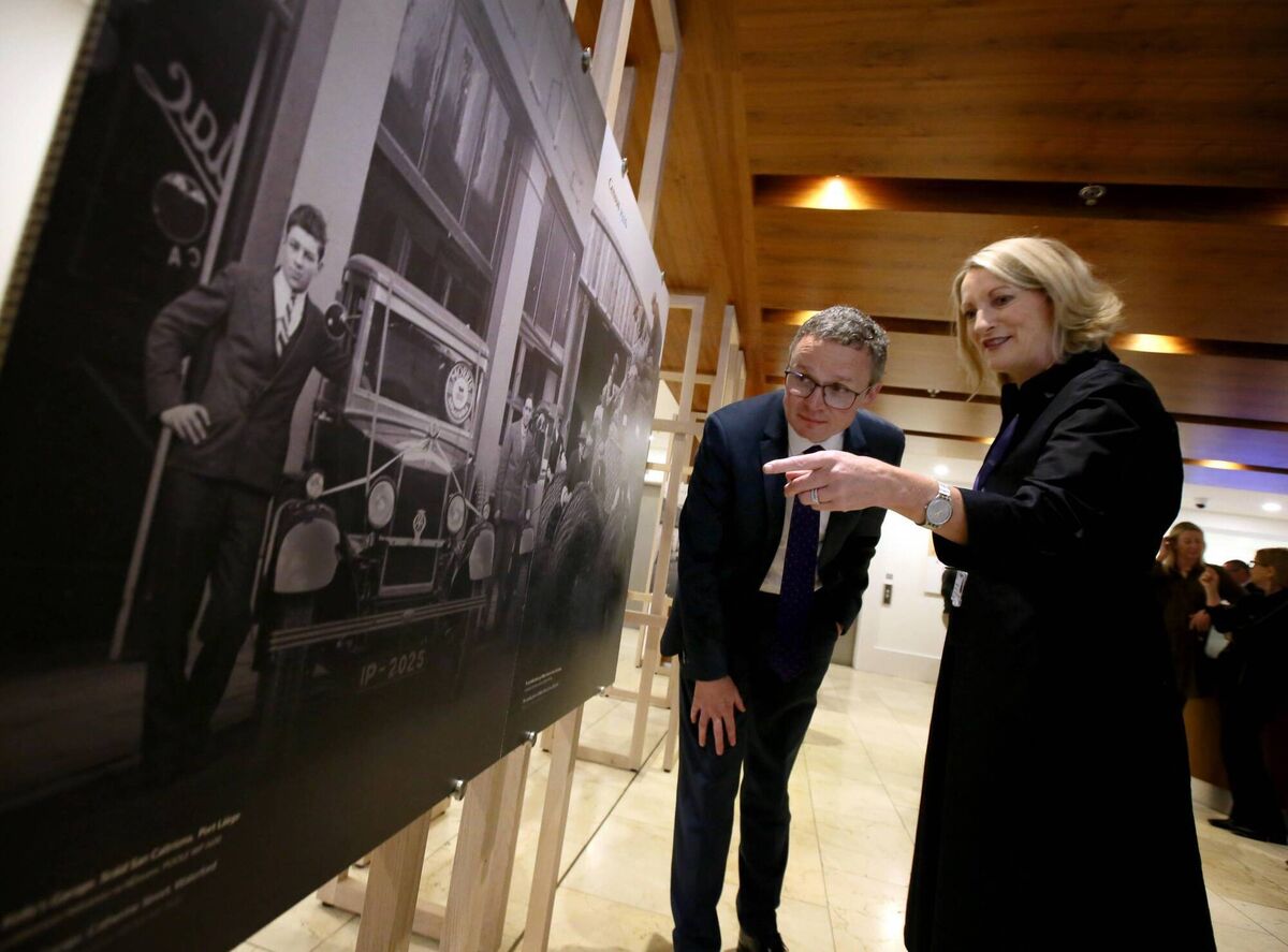 Culture minister Patrick O’Donovan and National Archives director Orlaith McBride study a vintage photo of Kelly's Garage on Catherine St, Waterford, at the launch of the public programme of events ahead of the centenary release of data from the 1926 Census. Picture: Mark Stedman