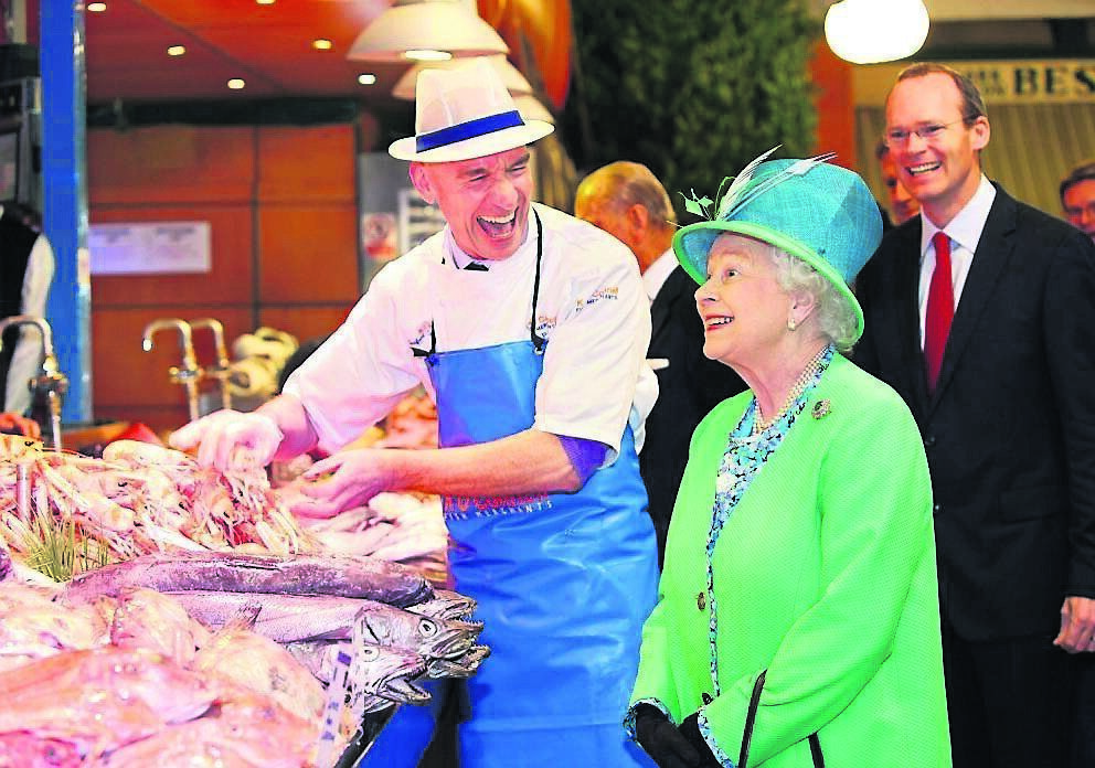 Queen Elizabeth II meeting fishmonger Pat O'Connell at The English Market in Cork City on her State Visit to Ireland, May 20, 2011. Picture: Maxwells/PA Wire