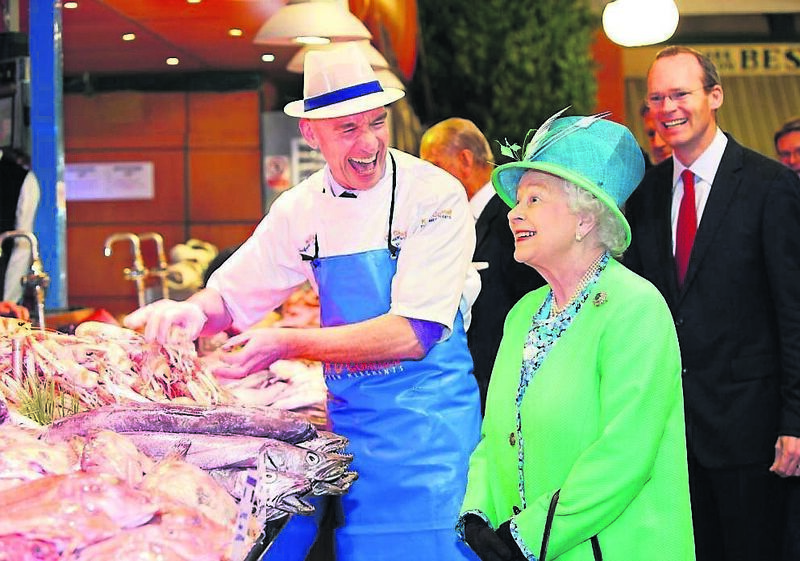 Queen Elizabeth II meeting fishmonger Pat O'Connell at The English Market in Cork City on her State Visit to Ireland, May 20, 2011. Picture: Maxwells/PA Wire