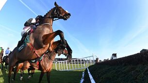 <p>RISING TO THE CHALLENGE: Heart Wood and Darragh O'Keeffe soar over a fence en route to winning the Grade Three O’Driscoll’s Irish Whiskey New Year’s Day Chase.  	Picture: Healy Racing</p>