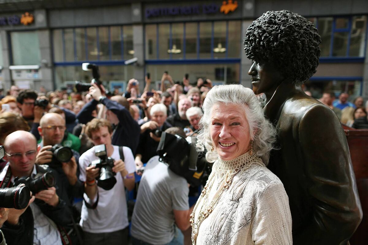Phil Lynott's mother Philomena Lynott is surrounded by press photographers at the unveiling of the repaired statue of the Thin Lizzy frontman on Harry St off Grafton St, Dublin in 2013. Picture: Julien Behal/PA Phil Lynott's mother Philomena Lynott is surrounded by press photographers at the unveiling of the repaired statue of the Thin Lizzy frontman on Harry St off Grafton St, Dublin in 2013. Picture: Julien Behal/PA