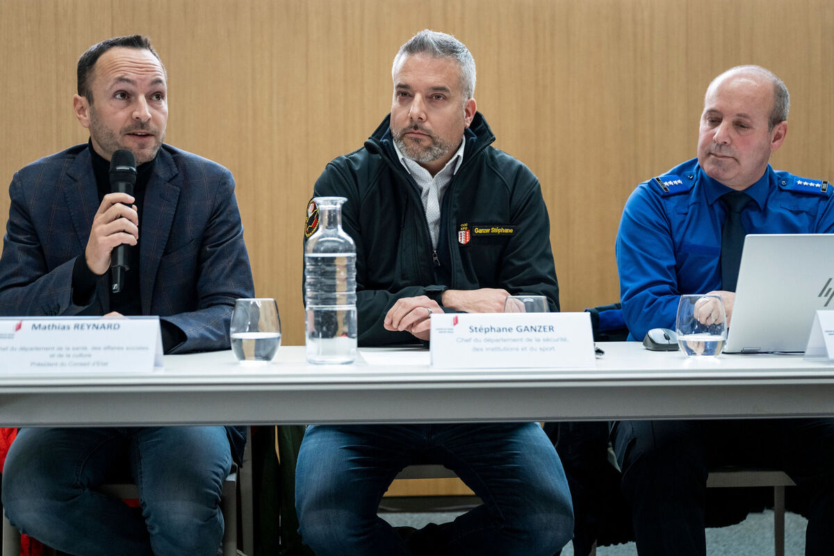 From left, Mathias Reynard, State Councillor and president of the Council of State of the Canton of Valais, Stephane Ganzer, State Councillor and head of the Department of Security, Institutions and Sport of the Canton of Valais and Frederic Gisler, Commander of the Valais Cantonal Police, during a press conference in Lens. (Alessandro della Valle/Keystone via AP)