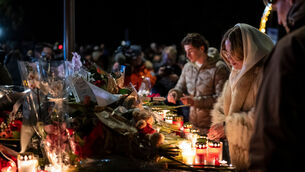 <p>Mourners gather to lay down flowers and light candles to remember the victims of the fire at the "Le Constellation" bar and lounge leaving people dead and injured, during New Year's celebration, in Crans-Montana, Switzerland, on Thursday, Jan. 1, 2026. (Alessandro della Valle/Keystone via AP)</p>