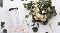 Checklist with main items, roses bouquet and golden rings