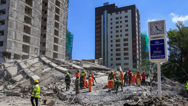 A rescue team works at the scene of a collapsed building in Nairobi(Andrew Kasuku/AP)