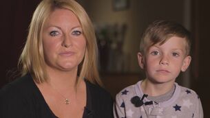 <p>Claire Cahill in 2017 with her son Darragh, then aged 7, when his plight was featured on 'RTÉ Investigates: Living on the List'. Picture: RTÉ </p>