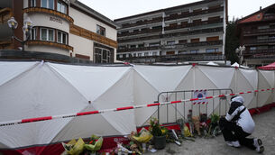People left flowers near the sealed off Le Constellation bar in Crans-Montana in the Swiss Alps (Antonio Calanni/AP) People left flowers near the sealed off Le Constellation bar in Crans-Montana in the Swiss Alps (Antonio Calanni/AP)