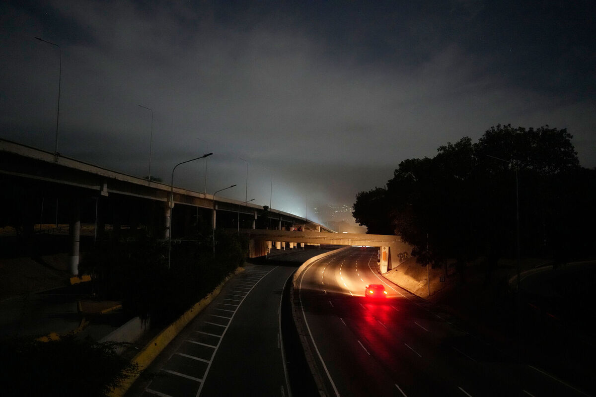 A vehicle drives along a darkened highway next to Fort Tiuna, the main military garrison in Caracas, Venezuela, after explosions and low-flying aircraft were heard, Saturday, Jan. 3, 2026. (AP Photo/Matias Delacroix) A vehicle drives along a darkened highway next to Fort Tiuna, the main military garrison in Caracas, Venezuela, after explosions and low-flying aircraft were heard, Saturday, Jan. 3, 2026. (AP Photo/Matias Delacroix)