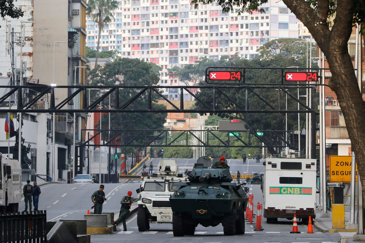 National Guard armored vehicles block an avenue leading to Miraflores presidential palace in Caracas, Venezuela, Saturday, Jan. 3, 2026. (AP Photo/Cristian Hernandez) National Guard armored vehicles block an avenue leading to Miraflores presidential palace in Caracas, Venezuela, Saturday, Jan. 3, 2026. (AP Photo/Cristian Hernandez)