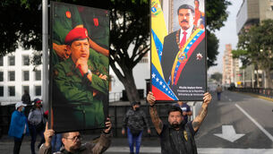 <p>Government supporters display posters of Venezuelan President Nicolás Maduro, right, and former President Hugo Chávez in downtown Caracas, Venezuela, Saturday, Jan. 3, 2026. Picture: AP Photo/Matias Delacroix</p> <p>Government supporters display posters of Venezuelan President Nicolás Maduro, right, and former President Hugo Chávez in downtown Caracas, Venezuela, Saturday, Jan. 3, 2026. Picture: AP Photo/Matias Delacroix</p>