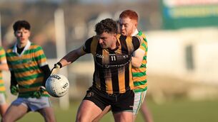<p>Strokestown centre-forward, Kevin Finn, shields possession from his Glenullin opponent. Picture: Bernie O'Farrell</p> <p>Strokestown centre-forward, Kevin Finn, shields possession from his Glenullin opponent. Picture: Bernie O'Farrell</p>