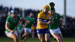 <p>Mark Rodgers in action against Limerick players, from left, Vince Harrington and Darragh Langan at Páirc an Dálaigh. Pic: John Sheridan/Sportsfile</p>