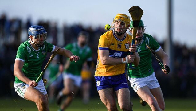 <p>Mark Rodgers in action against Limerick players, from left, Vince Harrington and Darragh Langan at Páirc an Dálaigh. Pic: John Sheridan/Sportsfile</p>