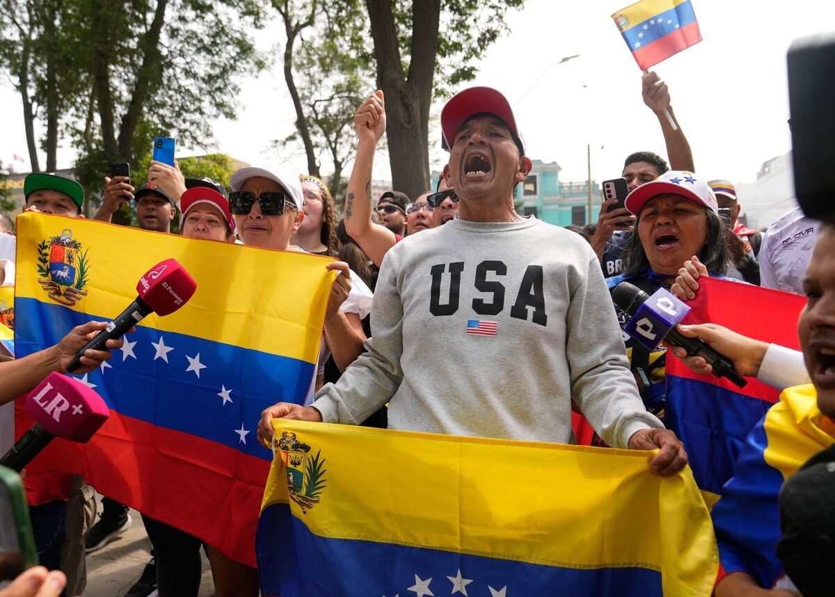 Venezuelans celebrate after President Donald Trump announced that Venezuelan President Nicolas Maduro had been captured and flown out of the country, in Lima, Peru, Saturday, Jan. 3, 2026. (AP Photo/Martin Mejia) Venezuelans celebrate after President Donald Trump announced that Venezuelan President Nicolas Maduro had been captured and flown out of the country, in Lima, Peru, Saturday, Jan. 3, 2026. (AP Photo/Martin Mejia)