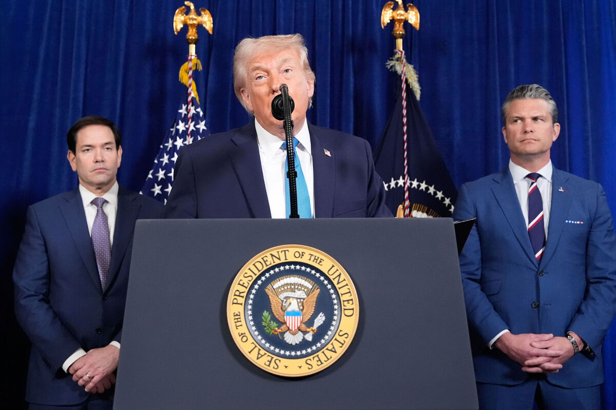 President Donald Trump speaks at his Mar-a-Lago club, Saturday, Jan. 3, 2026, in Palm Beach, Fla, as Secretary of State Marco Rubio and Defense Secretary Pete Hegseth listen. (AP Photo/Alex Brandon)