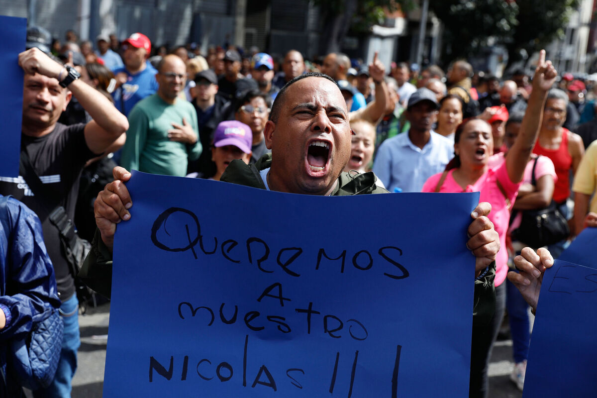 A supporter of Venezuelan President Nicolás Maduro displays a sign reading in Spanish "We want our Nicolás" during a rally in Caracas, Venezuela, Saturday, Jan. 3, 2026, after U.S. President Donald Trump announced Maduro had been captured and flown out of the country. (AP Photo/Cristian Hernandez) A supporter of Venezuelan President Nicolás Maduro displays a sign reading in Spanish "We want our Nicolás" during a rally in Caracas, Venezuela, Saturday, Jan. 3, 2026, after U.S. President Donald Trump announced Maduro had been captured and flown out of the country. (AP Photo/Cristian Hernandez)
