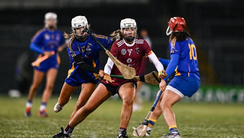 Sinéad Feeney of Athenry loses her hurl as she is tackled by Nicole Olden, left, and Sorcha McCartan of St Finbarr’s. Pic: Ben McShane/Sportsfile