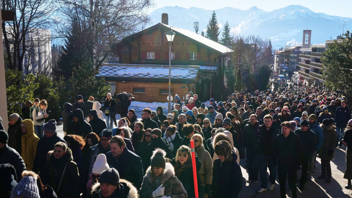 Hundreds march in silence to honour victims of Swiss bar fire