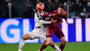 <p>TOUGH GOING: Juventus' Italian defender Daniele Rugani and Roma's Irish forward Evan Ferguson fight for the ball. Pic: MARCO BERTORELLO / AFP via Getty Images.</p>