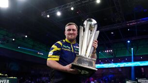 <p>LITTLER AND LARGE: Luke Littler celebrates with the Sid Waddell trophy.</p>