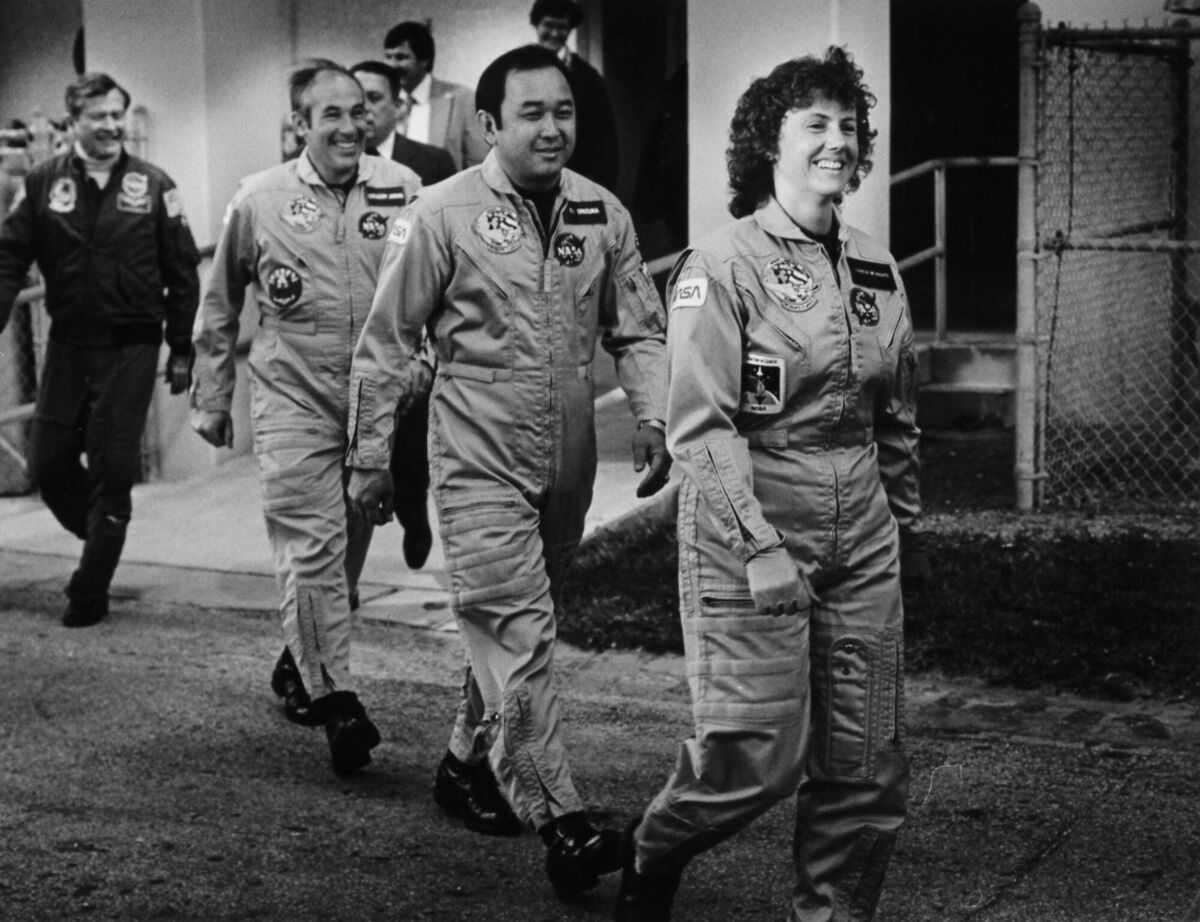 Crew members of the space shuttle Challenger walk to the launch pad in Cape Canaveral on January 28, 1986. The shuttle exploded 73 seconds after lift-off, killing all astronauts inside and delivering a jolt to the US national psyche.	Picture: Janet Knott/Boston Globe/Getty 
