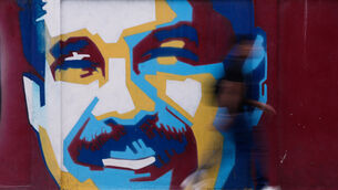 <p>A pedestrian walks past a mural of Venezuelan president Nicolas Maduro. Picture: AP Photo/Matias Delacroix</p> <p>A pedestrian walks past a mural of Venezuelan president Nicolas Maduro. Picture: AP Photo/Matias Delacroix</p>