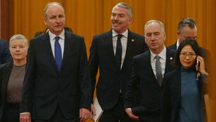 <p>Taoiseach Micheál Martin, second left, and his delegation arrives at the Great Hall of the People to meet with Chinese president Xi Jinping in Beijing today. Photo: AP/Andy Wong</p>