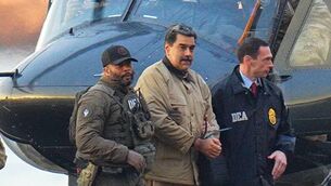 <p>NEW YORK, NY - JANUARY 5: Nicolas Maduro is seen in handcuffs after landing at a Manhattan helipad, escorted by heavily armed Federal agents as they make their way into an armored car en route to a Federal courthouse in Manhattan on January 5, 2026 in New York City. (Photo by XNY/Star Max/GC Images)</p>