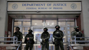 <p>Federal law enforcement personnel stand watch outside the Metropolitan Detention Center as they await the arrival of captured Venezuelan president Nicolás Maduro in New York Picture: Yuki Iwamura/AP</p>