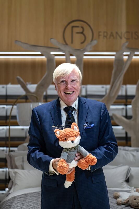Francis Brennan at Dunnes Stores, Patrick Street, Cork, marking a decade of his Francis Brennan The Collection range, with Frank Fox, the beloved stuffed toy mascot, in front of a fully dressed bed display. Picture Chani Anderson. Francis Brennan at Dunnes Stores, Patrick Street, Cork, marking a decade of his Francis Brennan The Collection range, with Frank Fox, the beloved stuffed toy mascot, in front of a fully dressed bed display. Picture Chani Anderson.
