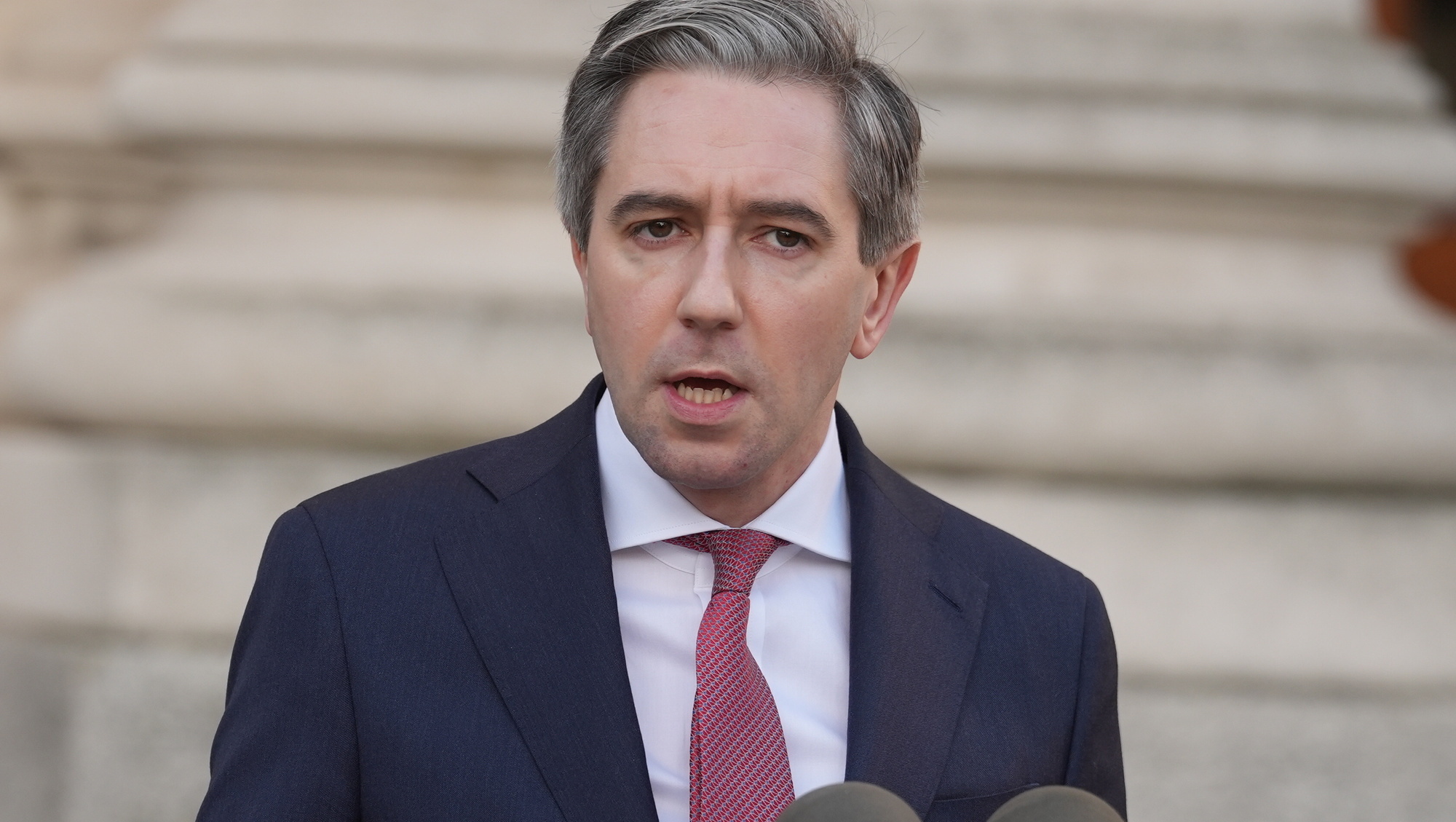 Simon Harris says country not taking ‘soft’ approach on US