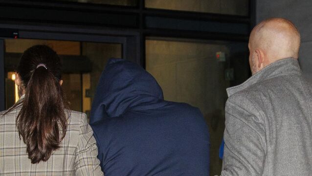 <p>Michael Maloney (centre), aged 32, of Loughros Point, Ardara, appeared before a special sitting of Letterkenny District Court on Tuesday evening. Picture: Liam McBurney/PA</p>