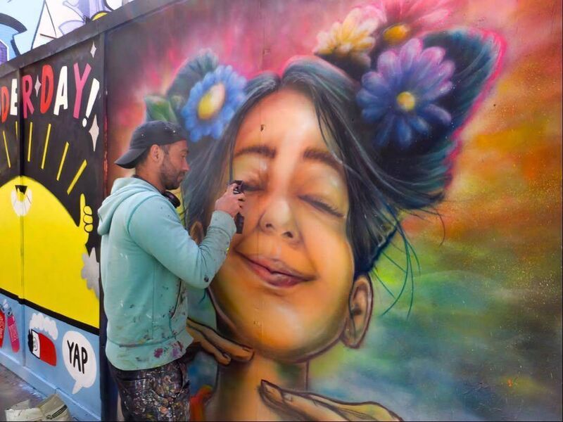 Street artist Raffaele Muraca at work on another mural