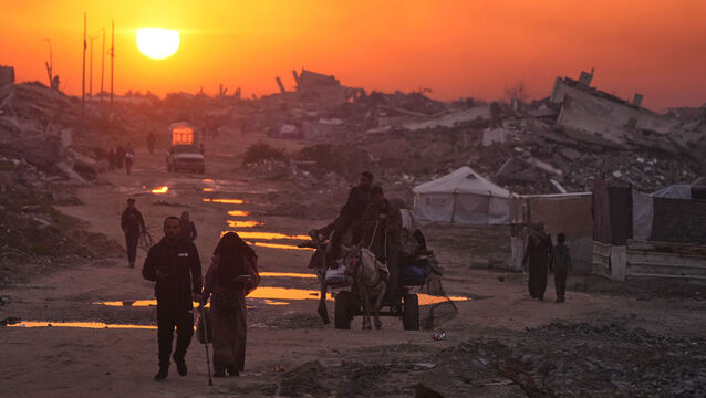 <p>Palestinians walk past destroyed buildings in Gaza city on Sunday. Irish exports to the Occupied Territories have been in continuous decline. Photo: AP/Jehad Alshrafi</p>