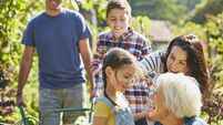 Multi-generation family bonding in sunny garden