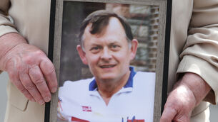 <p>Bridie Brown, the widow of murdered GAA official Sean Brown, holds a picture of him, outside the Royal Courts of Justice in Belfast. Picture: PA</p> <p>Bridie Brown, the widow of murdered GAA official Sean Brown, holds a picture of him, outside the Royal Courts of Justice in Belfast. Picture: PA</p>