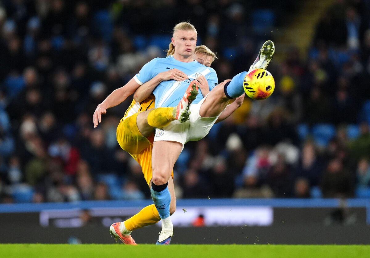 Brighton's Jan Paul van Hecke (left) and Manchester City's Erling Haaland battle for the ball. Pic: Mike Egerton/PA
