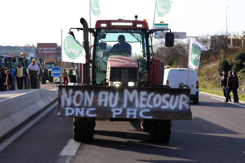 A French farmer drives his tractor to block a main road during a protest against the Mercosur trade deal with South American nations in Portet-sur-Garonne, southwestern France. Picture: Fred Scheiber/AP A French farmer drives his tractor to block a main road during a protest against the Mercosur trade deal with South American nations in Portet-sur-Garonne, southwestern France. Picture: Fred Scheiber/AP